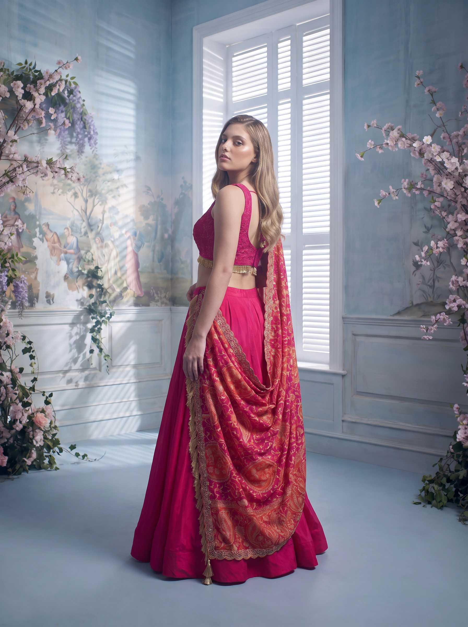 Back-view editorial portrait of the pink couture look